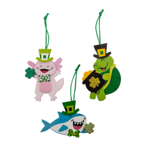 Axolotl, shark, and turtle wearing St. Patrick's day attire