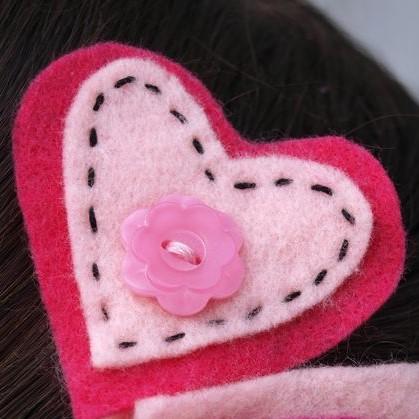 Felt hearts with decorative sewing and button